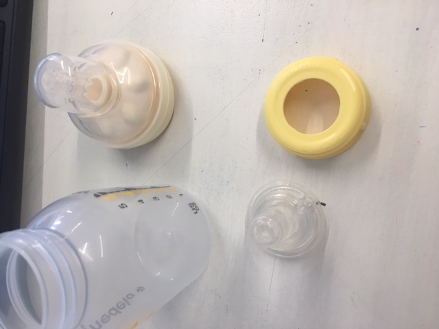 Top left: Calma teat and bottle neck.   Top Right: Yellow screw lid which is available to purchase as a spare part.   Bottom Right: Chu Chu teat.